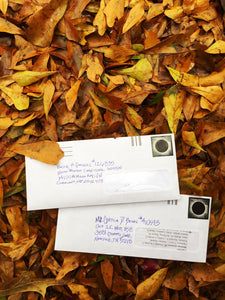 writing letters to prisoners on reused paper